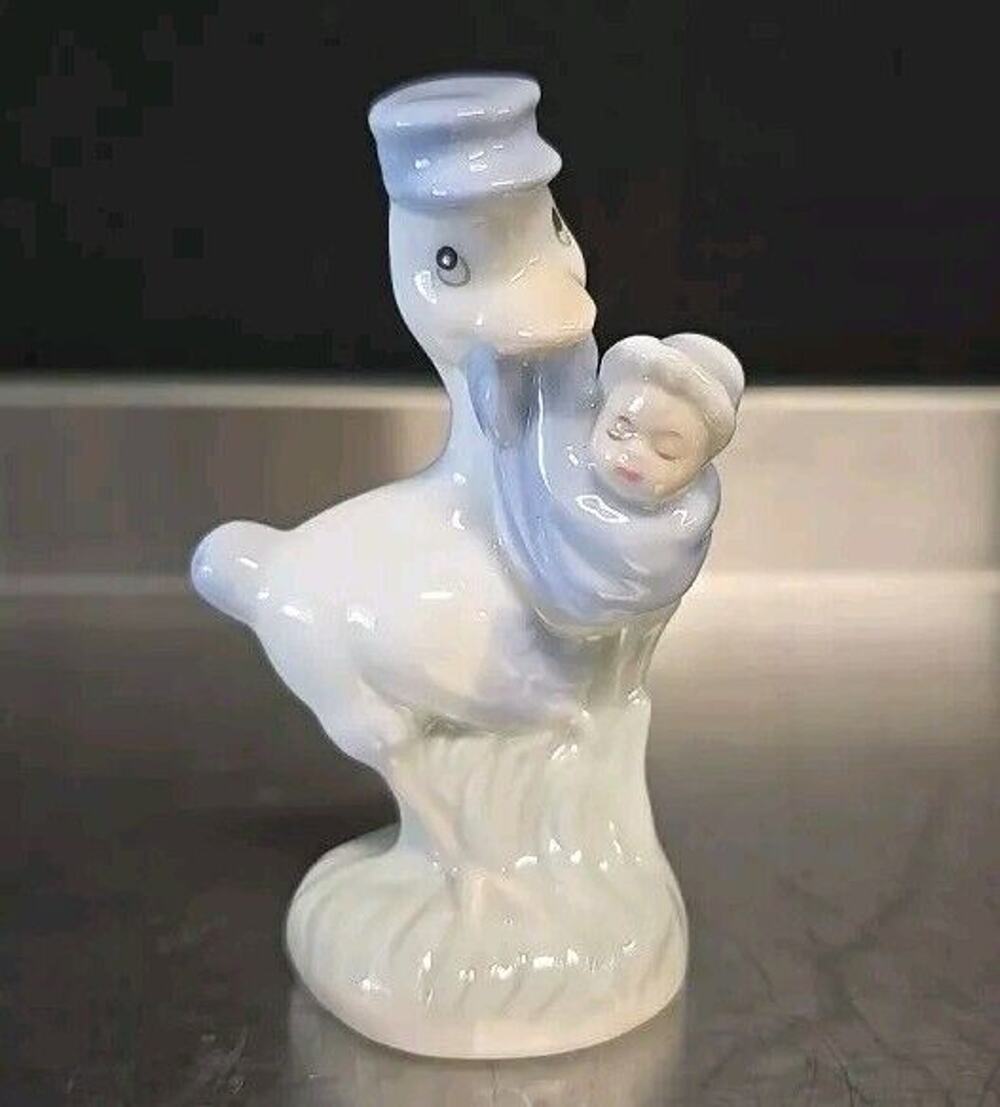 Vintage Porcelain Bird Stork Carrying Baby Infant Figurine